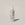 A bottle of ACURE Bonding Leave-In Conditioner spray on a neutral background.